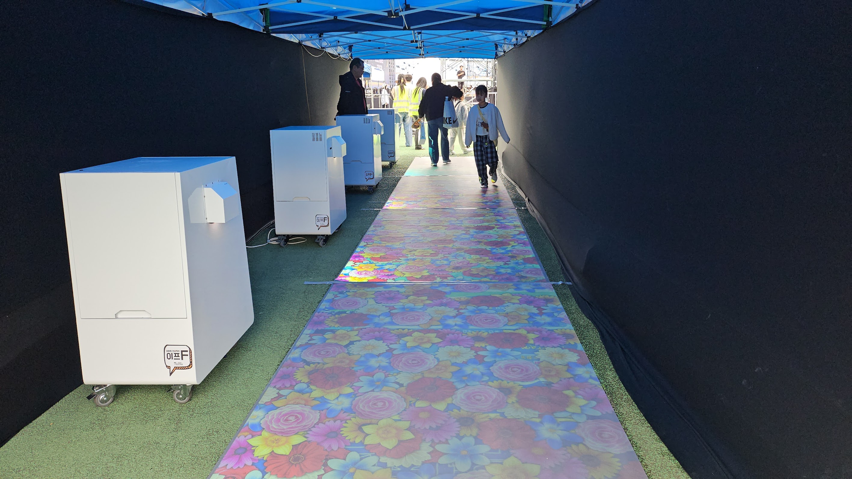 Dongducheon outdoor interactive floor — people stepping on projected scene