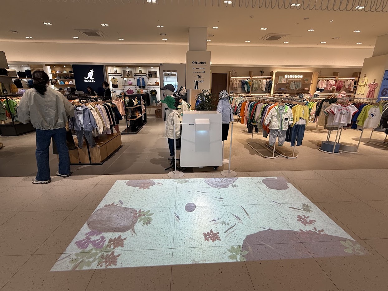 A digital pond on the kids-zone floor